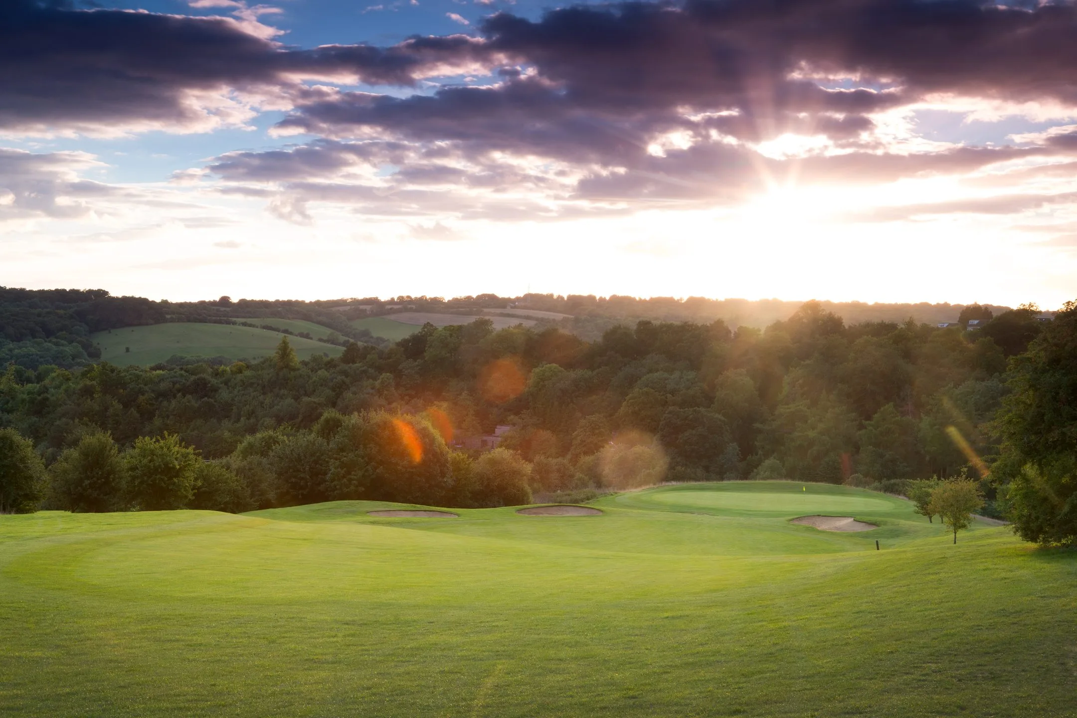 Bright, sunny day with views over a golf hole at one of the leading golf courses in Buckinghamshire