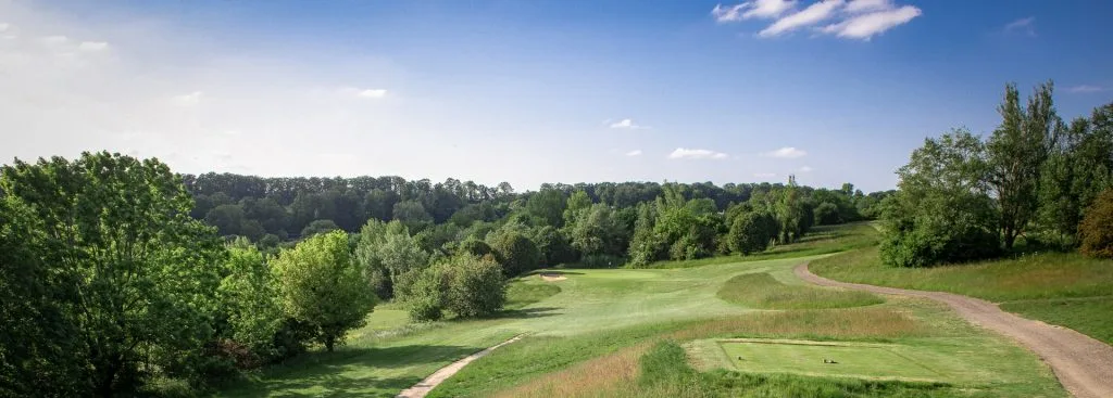 A tree-lined fairway at Wycombe Heights Golf Club in High Wycombe